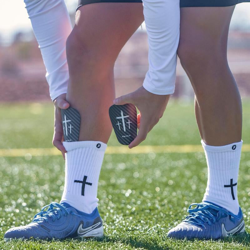 Premium Black Cross Mini Shin Guards for Enhanced Performance