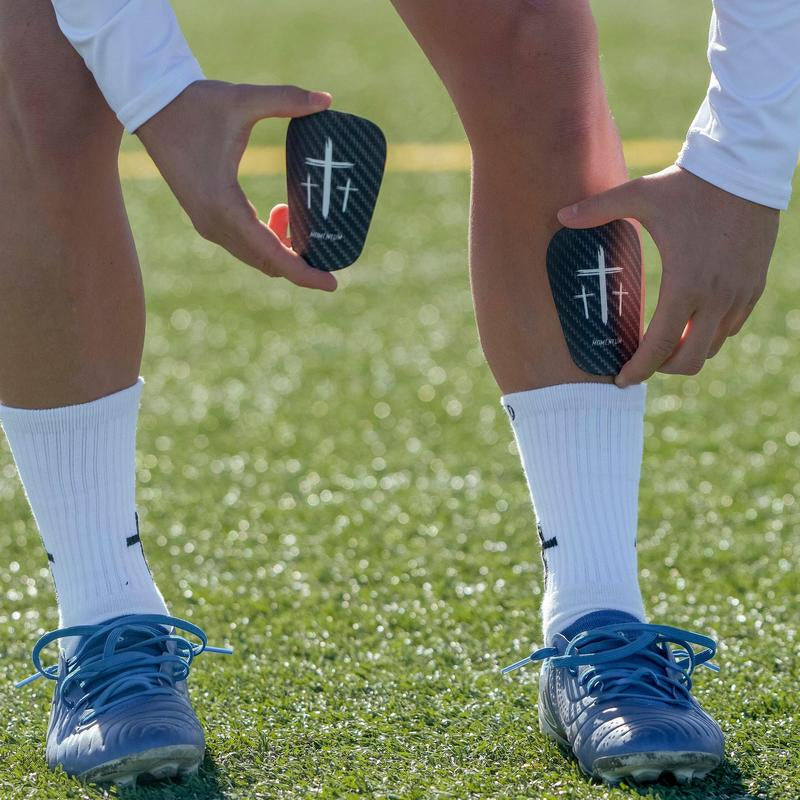 Premium Black Cross Mini Shin Guards for Enhanced Performance