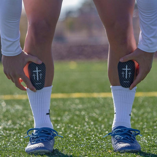 Premium Black Cross Mini Shin Guards for Enhanced Performance